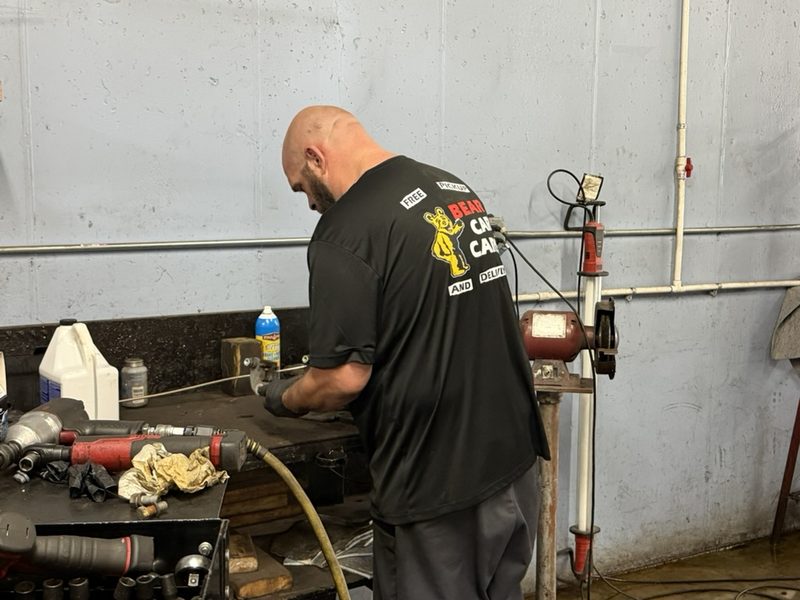 Bear Car Care technician at the workbench in the shop
